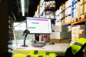 Small business fulfillment warehouse with staff packing and shipping ecommerce orders